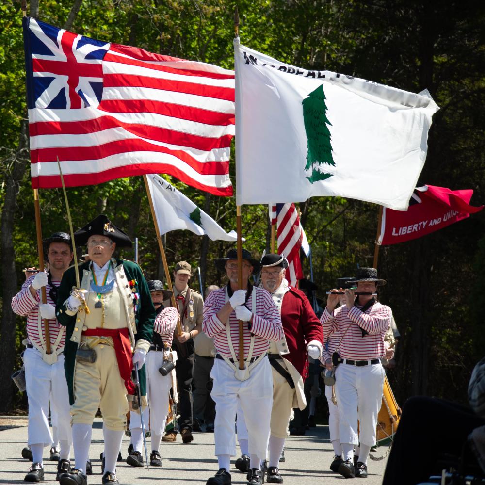 Revolutionary War reenactors marched toward Rochester Town Hall in May for the dedication of a Revolutionary War monument. Photo by Sawyer Smook-Pollitt